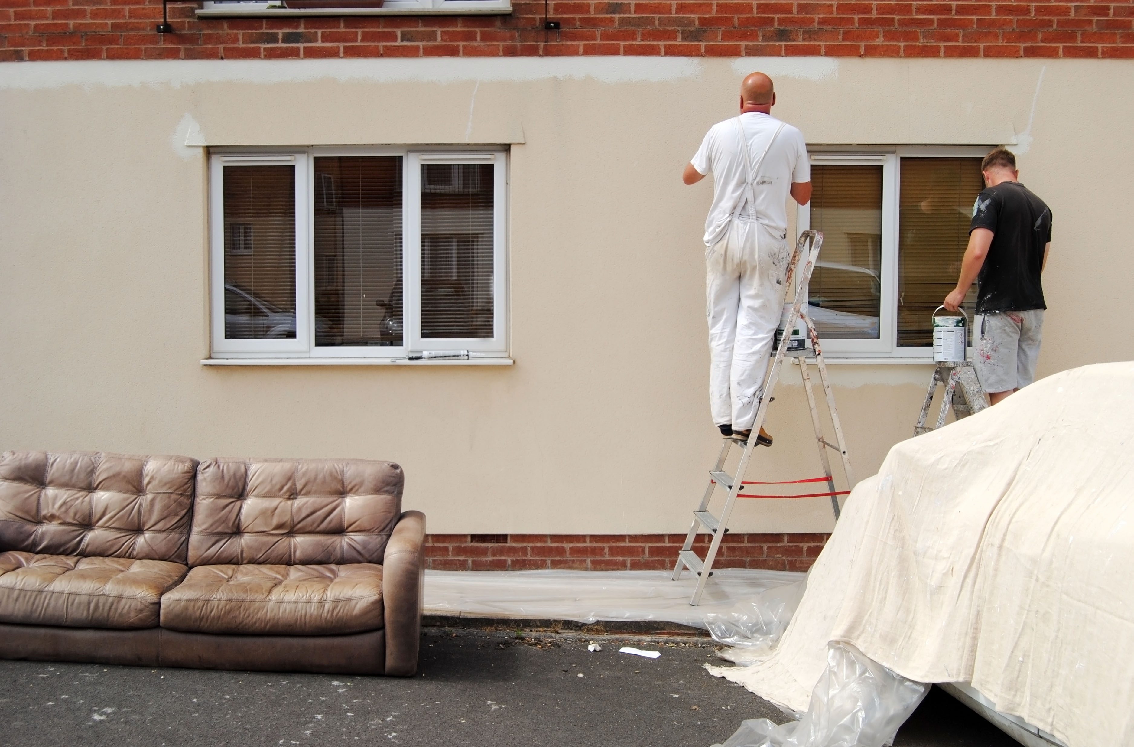 Two,Painters,In,A,Window,Painting,Residential,Building,Facade,With